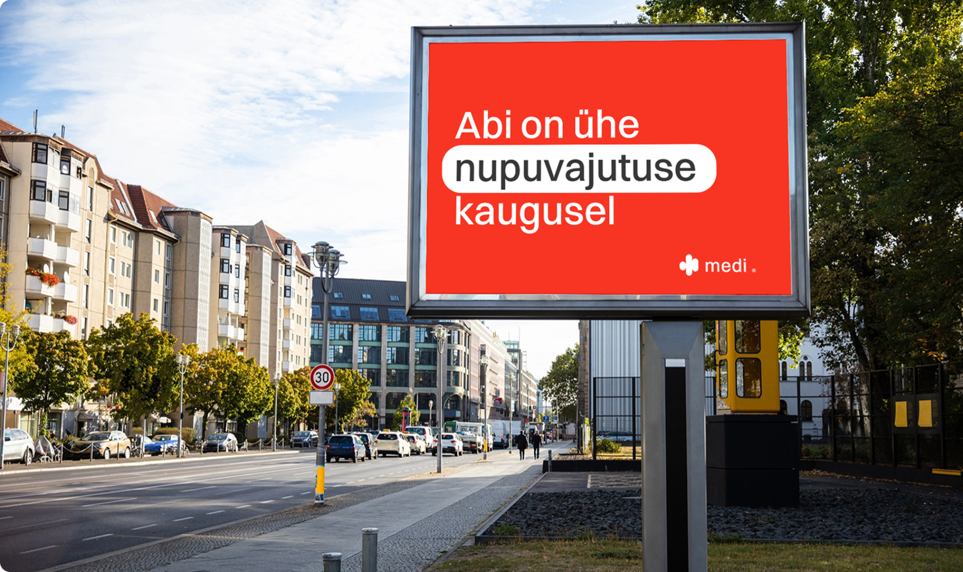 Reklaamtahvel linnaruumis sõnumiga „Abi on ühe nupuvajutuse kaugusel“.